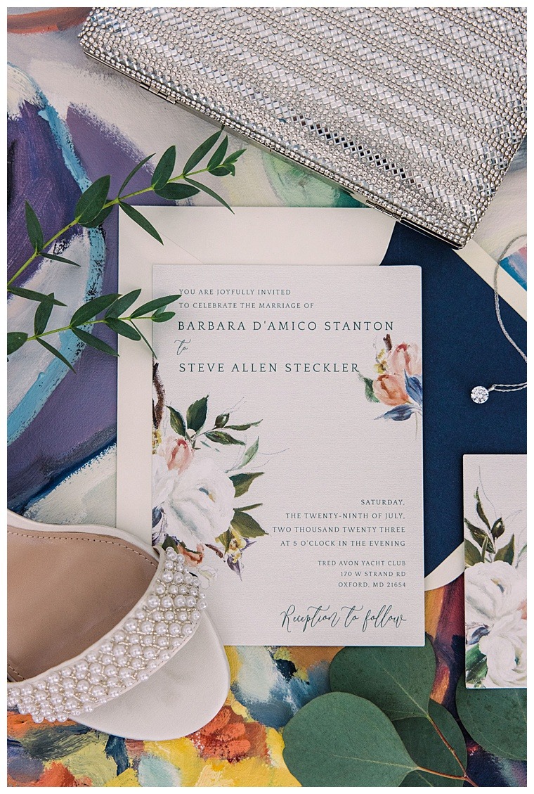 Laura's Focus Photography beautifully captured the couple's invitation suite and wedding day details in this styled image.