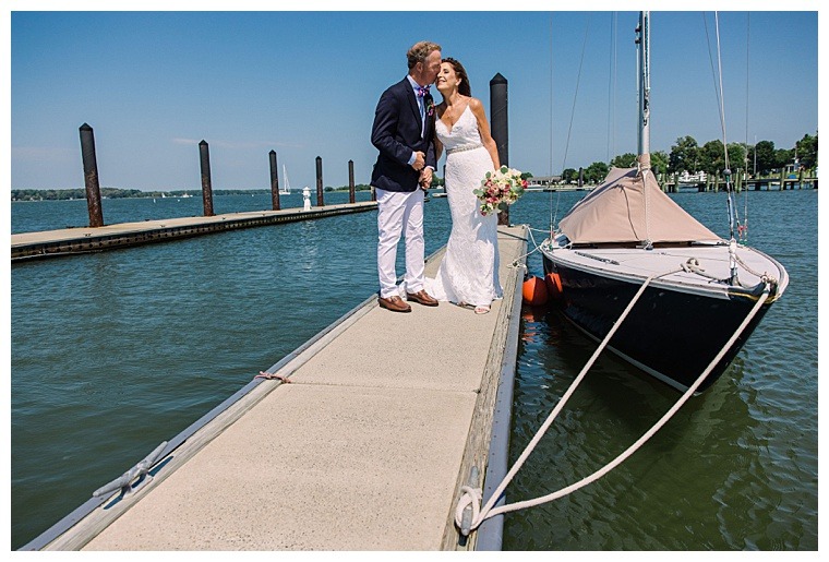 The bride and groom share a private moment on the dock at the Tred Avon Yacht Club before the festivities begin and get to bask in the beauty of their wedding day