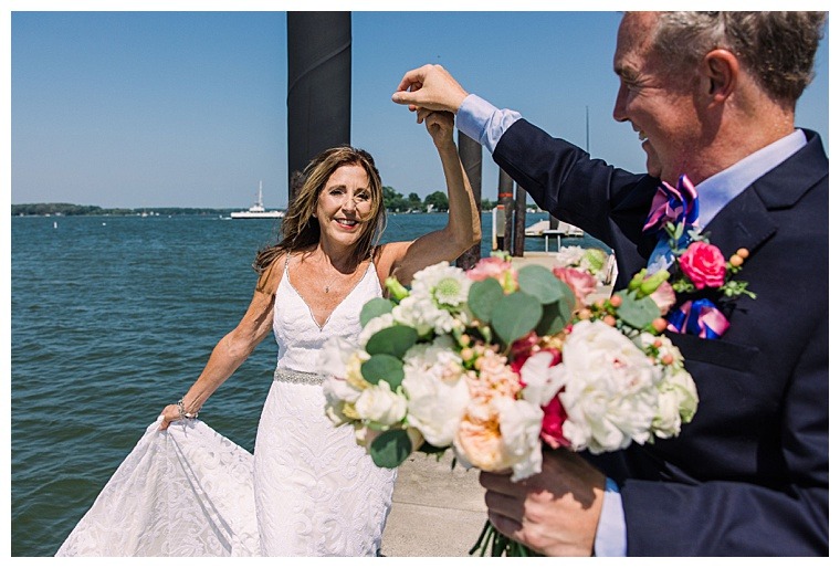 Barbie and Steve dance on the dock of the Tred Avon Yacht Club enjoying the wedding day views of their ceremony site and beautiful waterfront backdrop