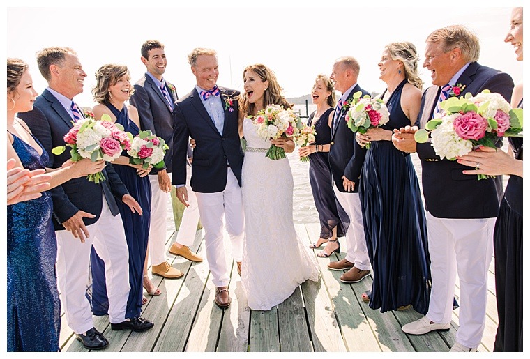 Barbie and Steve take a walk along the docks of the Tred Avon Yacht Club enjoying the waterfront views with their bridesmaids and groomsmen